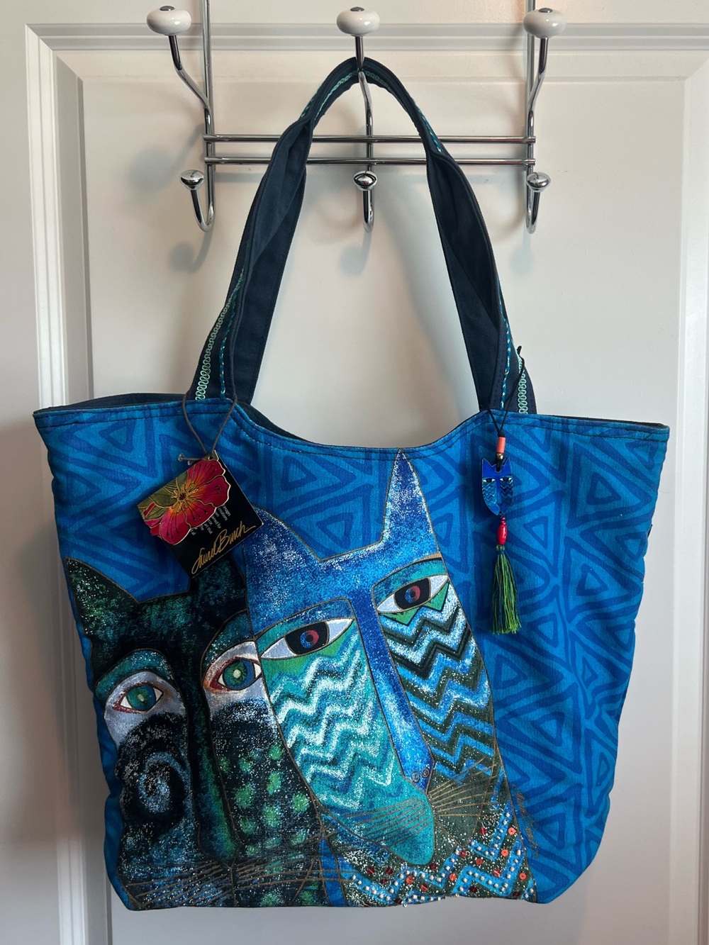 Laurel Burch cotton canvas tote features a vibrant blue cat design